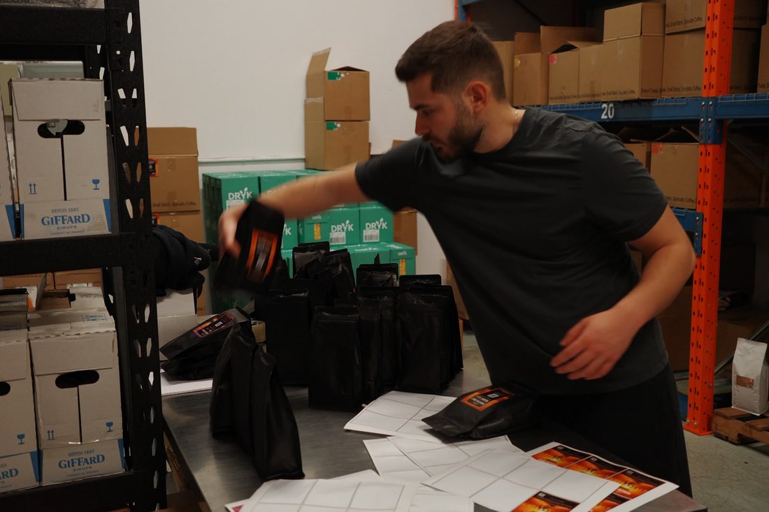 Packing a wholesale coffee order at the Ridgeline warehouse